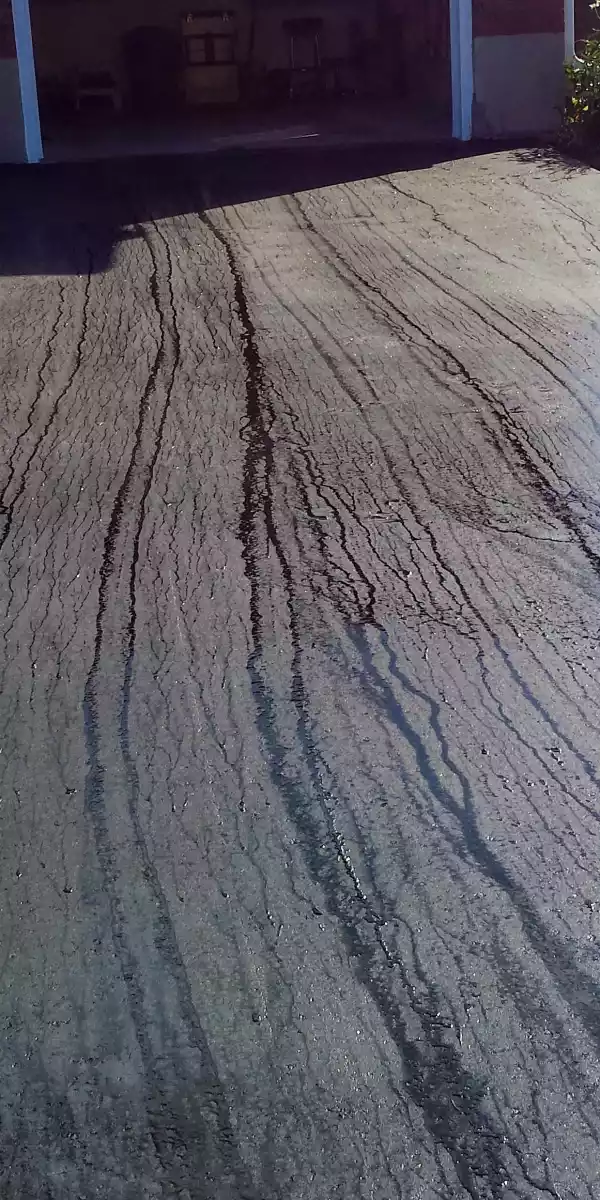 Asphalt driving paving in New Hamburg, receiving the finishing touches.